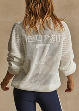 THE UPSIDE women's creme Fenway Sebastian Knit Crew is made with open knit organic cotton, for a relaxed fit. This long sleeve crew neck features a ribbed neckline and cuffs.