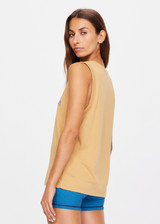 THE UPSIDE women's natural Jetset Jeet Tank is made with organic jersey cotton designed for a relaxed fit. This sleeveless tank features folded armhole details. A lifestyle essential.