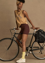 THE UPSIDE women's natural Jetset Jeet Tank is made with organic jersey cotton designed for a relaxed fit. This sleeveless tank features folded armhole details. A lifestyle essential.