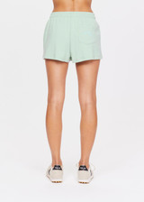 THE UPSIDE women's green Philosophy Zippy Short is made with organic cotton for a true to size fit. This mid-rise gym short features an elastic drawstring waistband and side pockets.