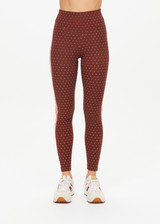 THE UPSIDE women's polka dot Maho 25 inch High Rise Midi Pant is made from a soft recycled ribbed fabric and features a soft folded waistband and contrast splice plan down the sides.