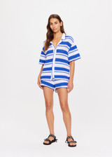 THE UPSIDE women's tonal white and blue striped Haven Lovett Crochet button through Shirt is made from hand crocheted cotton and features a collar and pink buttons and contrast stripes.