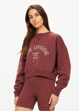 THE UPSIDE women's brown Jetset Dominique Crew cropped sweatshirt is made with organic cotton french terry, overdyed in plumberry, featuring a high neck band in soft rib.