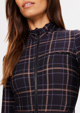 THE UPSIDE women's black check Lumiere Nova Jumpsuit is made in stretch fabric, for a soft fit. This all-in-one ski jumpsuit features thumbholes and a removable belt.