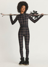 THE UPSIDE women's black check Lumiere Nova Jumpsuit is made in stretch fabric, for a soft fit. This all-in-one ski jumpsuit features thumbholes and a removable belt.