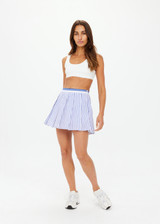 THE UPSIDE women's blue and white stripe Lyon Xavier Pleated Skirt is a pleated mini skirt with an elasticated stripe waistband, inner short with pockets and invisible side seam zipper opening.