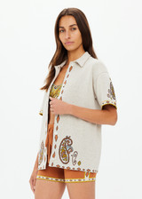 THE UPSIDE women's creme Vadella Collared Knit Shirt is made from organic cotton. It is a relaxed button up knit shirt and features a paisley design on a creme base. Designed for lounging and leisure.