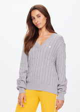 THE UPSIDE women's grey Seymour Cable Knit Sweater is made from organic cotton. Featuring a V shape neckline and ribbed cuffs, hem and neckline for comfort and style. Designed for leisure and recovery.
