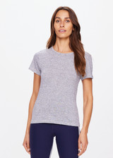 THE UPSIDE women's striped Pacey Stripe Tee is made from a hemp and organic cotton blend. The fitted baby style tee is designed with a contrast yellow arrow on the back for an elevated effect. Designed for light movement and recovery.