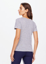 THE UPSIDE women's striped Pacey Stripe Tee is made from a hemp and organic cotton blend. The fitted baby style tee is designed with a contrast yellow arrow on the back for an elevated effect. Designed for light movement and recovery.