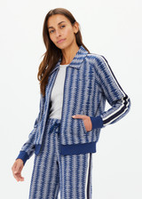 THE UPSIDE women's blue striped Joie Pari Zip Jacket is a jacquard zip through sports jacket, featuring knitted navy and cream stripe tape down sleeves for style and welt pockets and ribbed hem and cuffs for comfort. Designed for leisure and recovery.