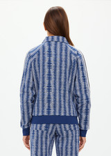 THE UPSIDE women's blue striped Joie Pari Zip Jacket is a jacquard zip through sports jacket, featuring knitted navy and cream stripe tape down sleeves for style and welt pockets and ribbed hem and cuffs for comfort. Designed for leisure and recovery.
