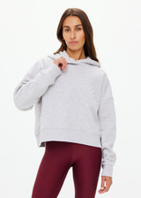 THE UPSIDE women's grey marle Byron Embossed Logo Hoodie is made from an organic cotton with a relaxed boxy shape featuring a tonal embossed horseshoe logo at the front.