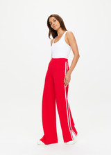 THE UPSIDE women's red Montana Freya Knit Pant is made from viscose blend. The straight pants features elastic waist and side stripe. Designed for lifestyle wear.