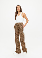 THE UPSIDE women's leopard Panthera Jetset Pant is made from viscose and rayon. The side stripe pants features pockets. Designed for travel and lounge.