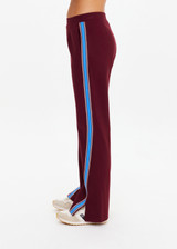 THE UPSIDE women's maroon Ryder Petra Flare Trackpant feature blue side stripes, a split hem, elasticated waist and side pockets.