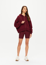 THE UPSIDE women's maroon oversized Ryder Jude Crop Zip-Up Hoodie is made from organic cotton and feature ribbed cuffs and a hemband.