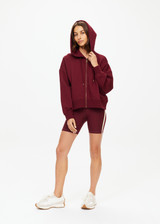THE UPSIDE women's maroon oversized Ryder Jude Crop Zip-Up Hoodie is made from organic cotton and feature ribbed cuffs and a hemband.
