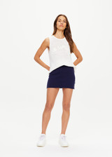 THE UPSIDE women's navy Eternity Zelma Knit Mini Skirt is made with organic cotton and features cream side stripes and mini splits at the hem.