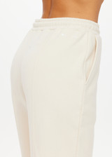 THE UPSIDE women's white organic cotton Hamilton Aries Track Pant is designed for a regular fit and features elasticated waistband and side seam pockets. Perfect for everyday.