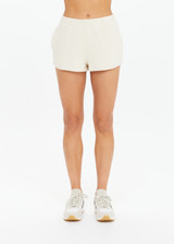 THE UPSIDE women's creme organic cotton Hamilton Dee Short is designed for a regular fit, featuring a elasticated waistband with side seam pockets. Made for everyday.