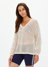 THE UPSIDE women's creme organic cotton Josephine V Neck Knit is a lightweight open knit designed for a relaxed fit with a deep V neckline. Made for everyday.