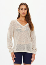 THE UPSIDE women's creme organic cotton Josephine V Neck Knit is a lightweight open knit designed for a relaxed fit with a deep V neckline. Made for everyday.