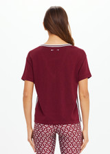 THE UPSIDE women's merlot Sienna V Neck Tee is a retro style slim fit track tee in a lightweight knit and features a deep V neckline. Made for everyday.
