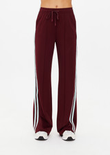 THE UPSIDE women's merlot Vitesse Marine Wide Leg Pant is a high rise fit and features a elasticated waistband, drawcord and side seam pockets in slinky fabrication. Made for lifestyle.