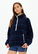 THE UPSIDE women's blue stripe Harlow Fleece Pullover is designed for a relaxed fit and features zip pockets and elasticated waist and cuffs. Made for lifestyle.