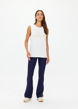THE UPSIDE women's white organic cotton Stardust Jeet Tank Top is designed for a relaxed fit and features printed star logo on front. Made for lifestyle.