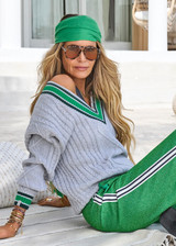 THE UPSIDE women's grey marle organic cotton Josette V Neck Knit Sweater is a regular fit and features cable detailing through front and a green striped neckline. Made for lifestyle.