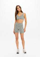 THE UPSIDE women's green Reversible 5inch Spin Short is designed for a soft & supportive fit in a recycled fabric and features embroidered arrow logo on back. Made for yoga & pilates.