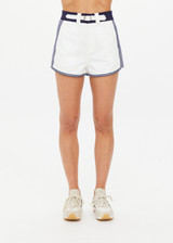THE UPSIDE women's white organic cotton Racer Short features a navy waistband with a built-in belt detail and back welt pockets. Made for everyday leisure.
