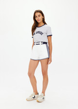 THE UPSIDE women's white organic cotton Racer Short features a navy waistband with a built-in belt detail and back welt pockets. Made for everyday leisure.