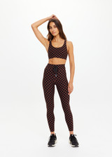 THE UPSIDE women's recycled peached black and chocolate check Technica Jade Bra is a full coverage sports bra with extra support and includes removable cups. Perfect for yoga, pilates & barre.
