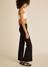 THE UPSIDE women's black classic Joyela Flare Pant is made from a lenzing viscose blend and features an embroidered arrow at the black.