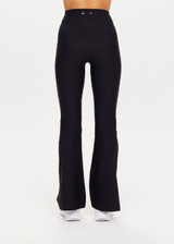 THE UPSIDE women's black Peached Florence Flare is a high-rise full length flare pant with V waistband and a printed arrow logo on back waistband.