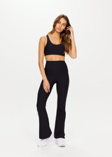 THE UPSIDE women's black Peached Florence Flare is a high-rise full length flare pant with V waistband and a printed arrow logo on back waistband.
