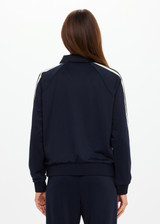 THE UPSIDE women's black Empire Pari Zip Jacket fits true-to-size and features a zip-through opening and knitted cream stripes down sides with a hint of silver metallic. Made for lifestyle.