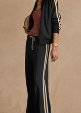 THE UPSIDE women's black Empire Marnie Wide Leg Pant is high-waisted and features a elasticated waistband with drawcord and side pockets. Made for lifestyle.