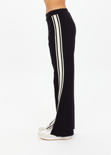 THE UPSIDE women's black Petra Flare Pant is made from soft suiting fabric and features elasticated waistband, side pockets and contrast cream stripes down side seams. Made for lifestyle.