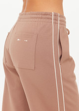 THE UPSIDE women's mocha Jetset Pant is designed for a regular fit and features an elasticated waist with a drawcord and front and back packets. The perfect everyday pant.