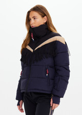 THE UPSIDE women's navy Hakuba Fox Puffer Jacket is a true-to-size fit, featuring a water-resistant coating, fringed detailing, fleece-lined zip pockets and an adjustable elastic at hem. Designed for Après-ski and winter wear.
