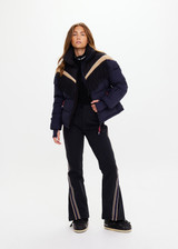 THE UPSIDE women's navy Hakuba Fox Puffer Jacket is a true-to-size fit, featuring a water-resistant coating, fringed detailing, fleece-lined zip pockets and an adjustable elastic at hem. Designed for Après-ski and winter wear.