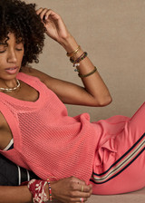 THE UPSIDE women's pink organic cotton Fenway Wales Knit Tank is designed for a relaxed fit and features an open knit construction. The perfect summer wardrobe addition.