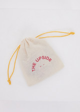 THE UPSIDE 4-Pack Hair Ties features soft elastics in tones of green, purple, silver, sand, burgundy, yellow, pink, and orange. Perfect for daily wear.