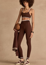 THE UPSIDE women's brown Form Seamless 25in Midi Pant is designed for a firm & supportive fit and features contrast white stripes on waist and ankles. Made for yoga & pilates.