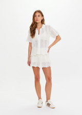 THE UPSIDE women's cream Agni Amayah Knit Shirt is designed for a relaxed fit and features a chevron knit design with pearlised shell buttons. The perfect vacation piece.