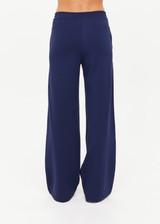 THE UPSIDE women's navy Ananda Wide Leg Cody Pant is a true-to-size fit and features an elasticated waistband, side pockets and knitted stripes down sleeves. The perfect everyday piece.